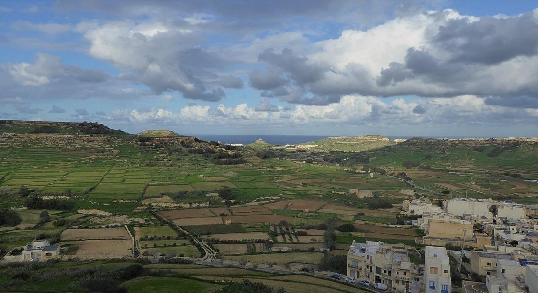 Gozo's patchwork countryside of fields and villages running down to the sea